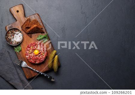 Savory beef tartare and brown bread toasts Savory beef tartare and brown bread toasts 109266201