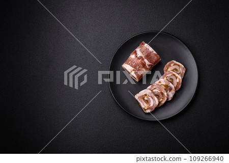 Delicious meatloaf with lard, salt, spices and herbs cut into slices Delicious meatloaf with lard, salt, spices and herbs cut into slices 109266940