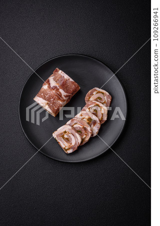 Delicious meatloaf with lard, salt, spices and herbs cut into slices 109266941