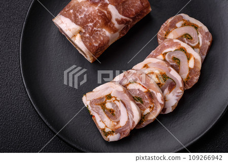 Delicious meatloaf with lard, salt, spices and herbs cut into slices Delicious meatloaf with lard, salt, spices and herbs cut into slices 109266942