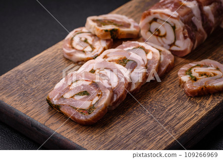 Delicious meatloaf with lard, salt, spices and herbs cut into slices Delicious meatloaf with lard, salt, spices and herbs cut into slices 109266969