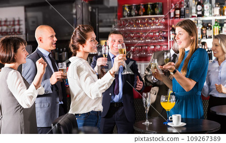 Two girls talking on corporate party Two girls talking on corporate party 109267389