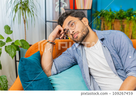 Indian man at home suffers from unfair situation problem, break up, depressed, feeling bad burnout 109267459