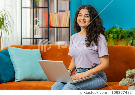 Young woman freelancer sitting on couch close laptop pc after finishing work in living room at home 109267482