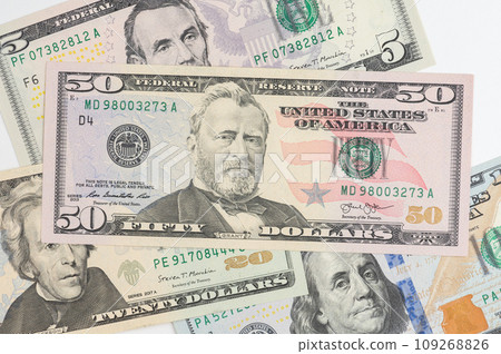 5, 20, 50, 100 dollars banknotes at different angles. Close up of dollars on white background. 5, 20, 50, 100 dollars banknotes at different angles. Close up of dollars on white background. 109268826
