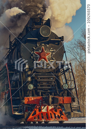 Old Soviet steam locomotive with a red star in Moscow in winter Old Soviet steam locomotive with a red star in Moscow in winter 109268870