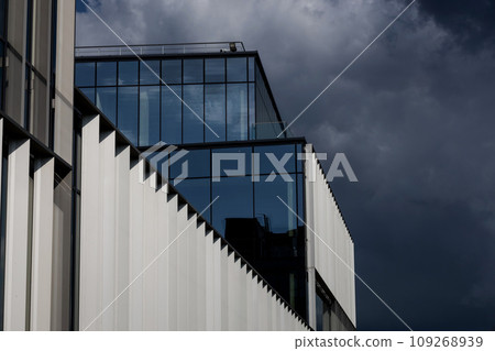 the facade of a glass office building the facade of a glass office building 109268939