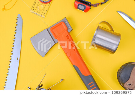 Camping and trekking equipment over yellow background Camping and trekking equipment over yellow background 109269875