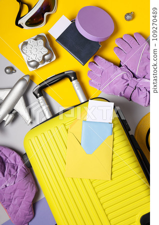 A suitcase with a passport, tickets and clothes 109270489