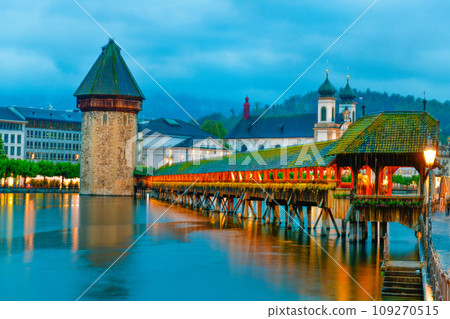 The famous "Chapel Bridge"wooden footbridge spanning across Reuss river The famous "Chapel Bridge"wooden footbridge spanning across Reuss river 109270515