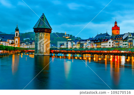 The famous "Chapel Bridge"wooden footbridge spanning across Reuss river The famous "Chapel Bridge"wooden footbridge spanning across Reuss river 109270516