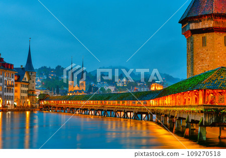 The famous "Chapel Bridge"wooden footbridge spanning across Reuss river The famous "Chapel Bridge"wooden footbridge spanning across Reuss river 109270518