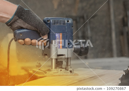 Hand male worker industry grinder tool object woodworking board plank close-up sunlight Hand male worker industry grinder tool object woodworking board plank close-up sunlight 109270867