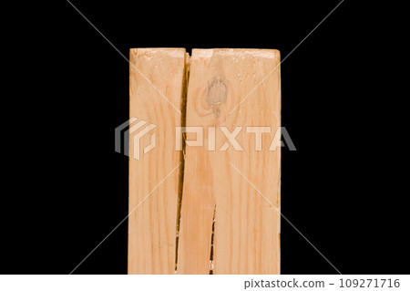 Wooden block with cracked wood object close-up on black background isolated 109271716