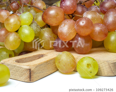 Grapes on a white background. berries for wine. Berry isolate. Sweet grapes kishmish. Grapes on a white background. berries for wine. Berry isolate. Sweet grapes kishmish. 109273426
