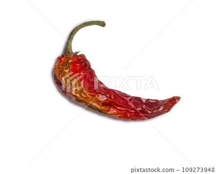 Dried red pepper on a white background. Ingredient for dishes. Spice concept. Wrinkled chili pepper. Dried red pepper on a white background. Ingredient for dishes. Spice concept. Wrinkled chili pepper. 109273948