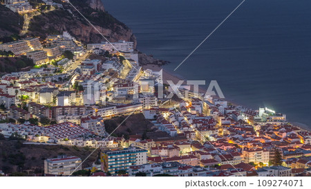 Aerial view of the coastline of the village of Sesimbra day to night timelapse. Portugal Aerial view of the coastline of the village of Sesimbra day to night timelapse. Portugal 109274071
