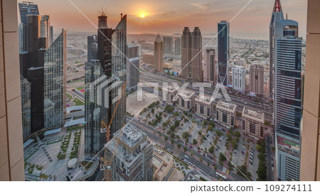 High-rise buildings on Sheikh Zayed Road in Dubai aerial timelapse during sunset, UAE. 109274111