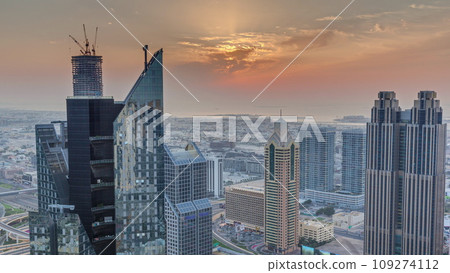 High-rise buildings on Sheikh Zayed Road in Dubai aerial timelapse during sunset, UAE. 109274112