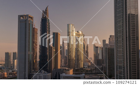 Many towers and skyscrapers with traffic on streets in Dubai Downtown and financial district morning timelapse. Many towers and skyscrapers with traffic on streets in Dubai Downtown and financial district morning timelapse. 109274121
