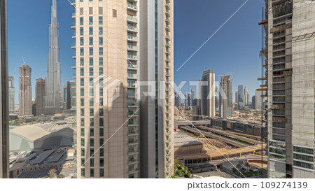 Tallest skyscrapers in downtown dubai located on bouleward street near shopping mall aerial timelapse. Tallest skyscrapers in downtown dubai located on bouleward street near shopping mall aerial timelapse. 109274139