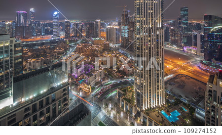 Panorama showing aerial view of a big futuristic city night timelapse. Business bay and Downtown Panorama showing aerial view of a big futuristic city night timelapse. Business bay and Downtown 109274152