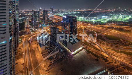Panorama showing Dubai marina and JLT skyscrapers along Sheikh Zayed Road aerial night timelapse. 109274282