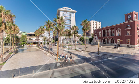 Panorama showing aerial view of the fountains and palms on the main square Sheshi Liria in Durres timelapse, Albania Panorama showing aerial view of the fountains and palms on the main square Sheshi Liria in Durres timelapse, Albania 109274325