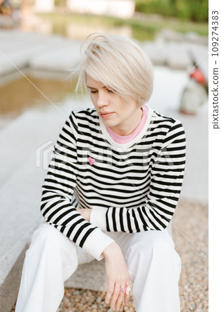 Photo of young attractive girl happy positive smile rest relax summer season park outdoors. 109274383