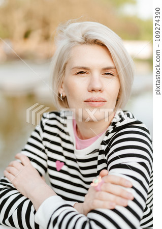 Photo of young attractive girl happy positive smile rest relax summer season park outdoors. 109274390