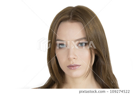 Face of a beautiful young girl on a white background 109274522