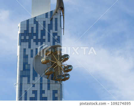 Batumi architecture. Carousel on a high-rise building. Ferris wheel built into the house. Unusual architecture. Urban landscape. 109274895