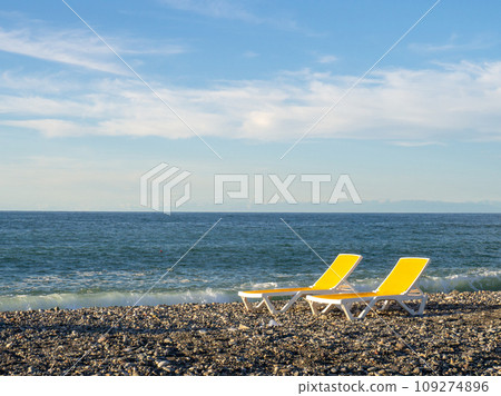 Rest on the sea. Beach beds. Quiet rest on the water. Business on the coast. 109274896