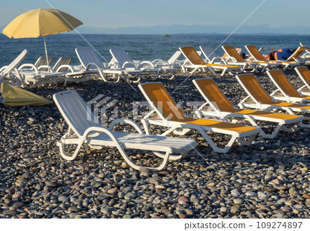 Rest on the sea. Beach beds. Quiet rest on the water. Business on the coast. 109274897