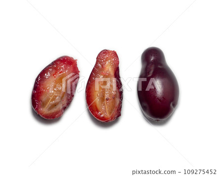 Dogwood berries. Sliced dogwood. The pulp of a juicy berry.   Isolate Ingredient for healthy nutrition. 109275452