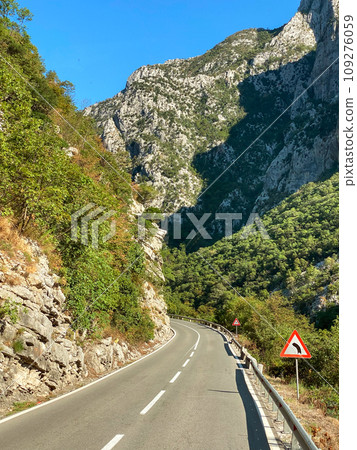 Turning mountain highway in Montenegro at sunny day 109276059