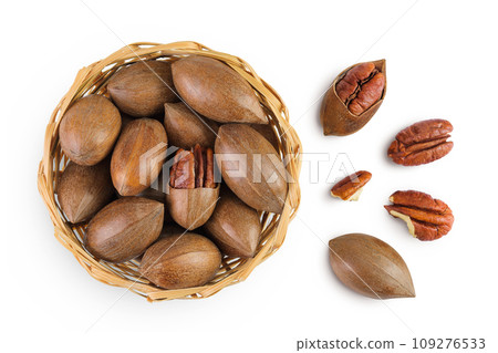 pecan nut in a wicker basket isolated on white background with full depth of field. Top view. Flat lay. 109276533