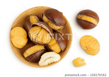 roasted peeled chestnut in wooden bowl isolated on white background. Top view. Flat lay roasted peeled chestnut in wooden bowl isolated on white background. Top view. Flat lay 109276562