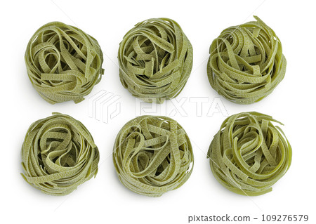 Raw tagliatelle green pasta with spinach isolated on white background. Top view. Flat lay 109276579