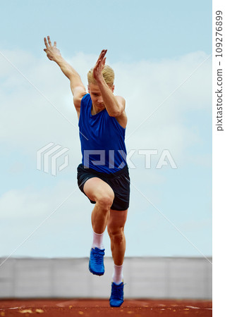Athlete in full motion, a study of speed. Full length portrait of man, professional sportsman fast running on sport field. 109276899