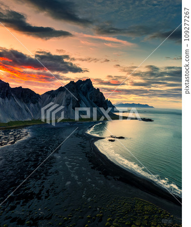 Sunset sky over Vestrahorn mountain and black sand beach in Stokksnes at Iceland Sunset sky over Vestrahorn mountain and black sand beach in Stokksnes at Iceland 109277267