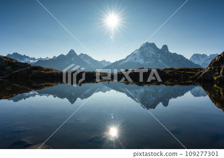 French Alps landscape of Lac des Cheserys with Mont Blanc massif and trail runner reflection at France 109277301