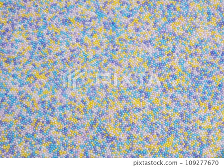 background of colorful sprinkles for sweets or beads or small balls. The concept of celebrating a birthday, party or other holidays. trendy, cute background. High quality background of colorful sprinkles for sweets or beads or small balls. The concept of celebrating a birthday, party or other holidays. trendy, cute background. High quality 109277670