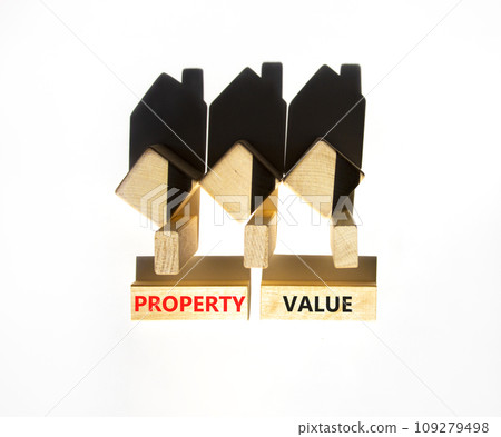 Property value symbol. Concept words Property value on beautiful wooden blocks. Beautiful white table white background. House model. Business property value concept. Copy space. 109279498