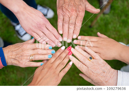 Concept of family, aging society or teamwork, hands showing unity with putting hands together 109279636