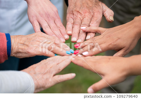 Concept of family, aging society or teamwork, hands showing unity with putting hands together 109279640