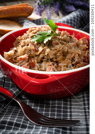 Bigos - sauerkraut stewed with meat, dried mushrooms and sausage. 109280411