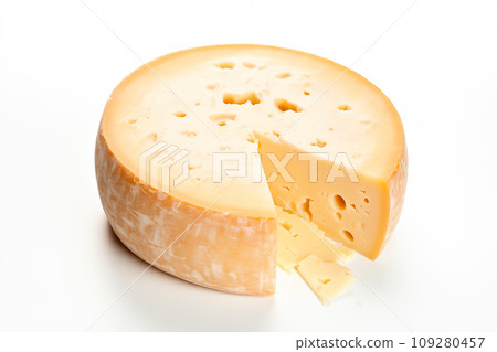 A closeup of a cheese with a slice taken away with holes like maasdam, emmental or cheddar as background 109280457