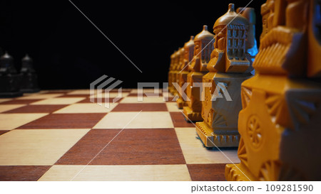 Slavic old styled chess pieces on wooden chessboard before party competition Slavic old styled chess pieces on wooden chessboard before party competition 109281590