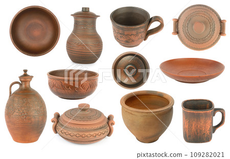 Collection of earthenware and ceramic dishes isolated on white. 109282021